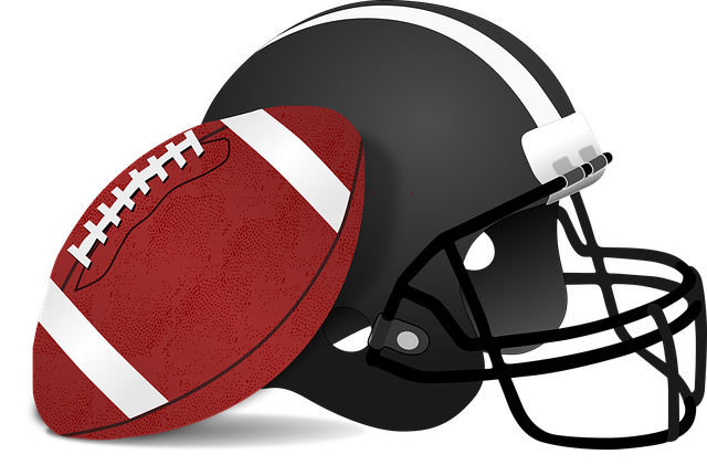 American football helmet with an American football leaning on it