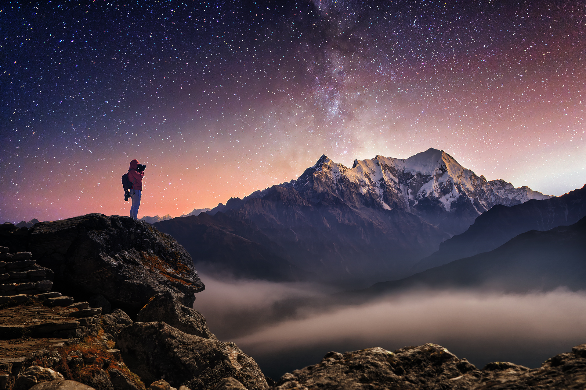 Before image of guy taking picture of mountians.